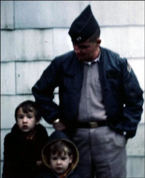 Captain Gary D. Humphries in uniform with two young sons